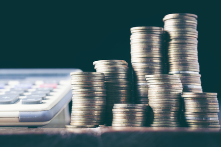 Coins stacked on each other in different positions. Money concept.の写真素材