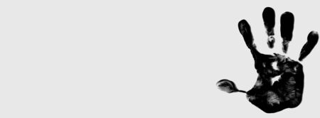 Black color handprint on a white background, depicting the idea of to stop violence against women, as palm symbol is used by the feminist movementの写真素材