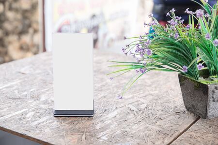 Menu frame standing on wood table in Bar restaurant cafe. space for text marketing promotionの写真素材