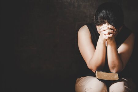 Christian life crisis prayer to god. Woman Pray for god blessing to wishing have a better life....