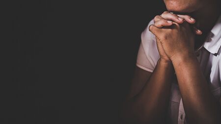 Christian life crisis prayer to god. Woman Pray for god blessing to wishing have a better life. woman hands praying to god with the bible. begging for forgiveness and believe in goodness.の写真素材
