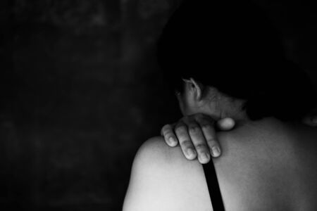 Fear, loneliness, depression, abuse, addiction  concept about violence against womenの写真素材