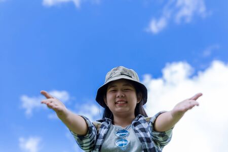 young women, look at the amazing mountains and forests, wanderlust travel ideas, space for messages, great moments of the atmosphere.の写真素材