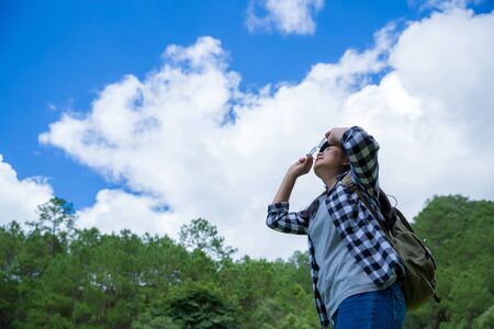 young women, look at the amazing mountains and forests, wanderlust travel ideas, space for messages, great moments of the atmosphere.の写真素材