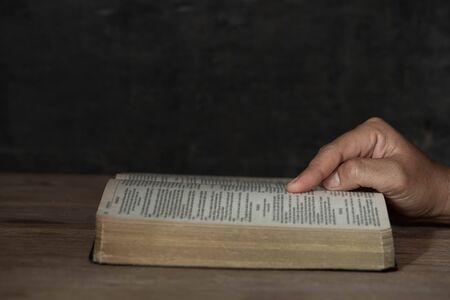  Bible on wooden background. Symbol of spirituality. World religion.	