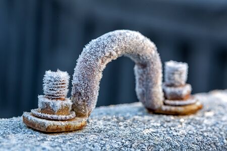 Frost on a cast iron surface. First slight frosts. Shallow depth of field. Selective focus.の写真素材