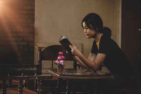 Teen girl christian read bible, Asian girl who believers praying and worshiping to god, Concept of...