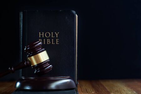 Judge's gavel and holy bible book on wooden tableの写真素材