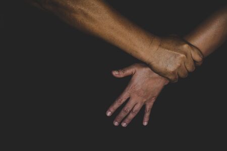 Man use force to assault woman. stop domestic violence against women campaign.