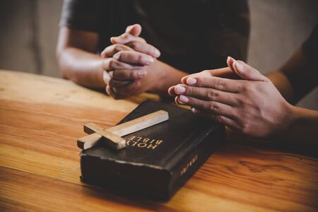 Family pray together praying with parent at home, online group worship, World Day of Prayer, international day of prayer, hope, gratitude, thankful, trustの写真素材