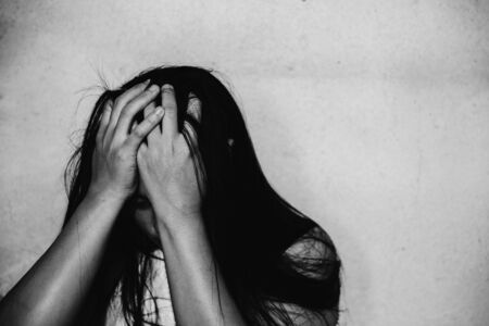 stressful and hopeless woman sitting on ground, abuse concept