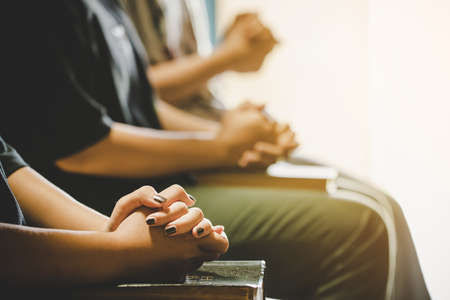 Three people pray and praising God together, They were sharing the gospel with copy space.の写真素材