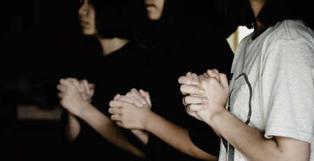 Three people pray and praising God together, They were sharing the gospel with copy space.の写真素材