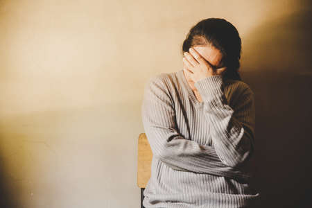 A woman sitting alone and depressed. The depression woman sit on the floor, abuse and people concept, stop violence against Women, international women's dayの写真素材