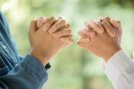 Christian people are praying to encourage and support together at home.