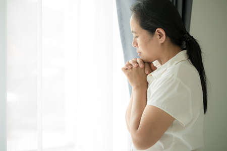 Christian life crisis prayer to god. Woman Pray for god blessing to wishing have a better life....