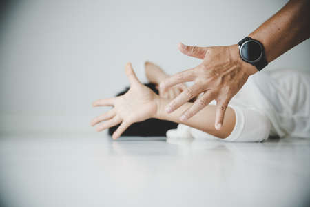 Aggression in the family, man beating up his wife. Domestic violence concept.の写真素材