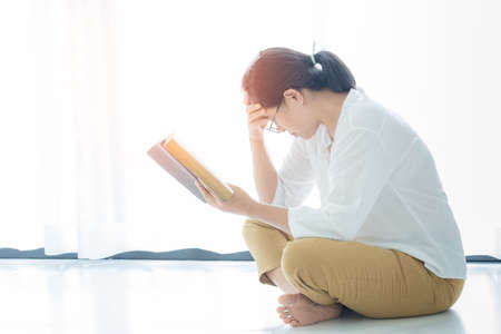 Christian life crisis prayer to god. Woman Pray for god blessing to wishing have a better life. woman hands praying to god with the bible. begging for forgiveness and believe in goodness.の写真素材