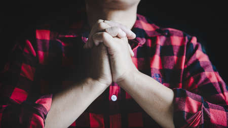 Christian life crisis prayer to god. Woman Pray for god blessing to wishing have a better life. woman hands praying to god with the bible. begging for forgiveness and believe in goodness.の写真素材