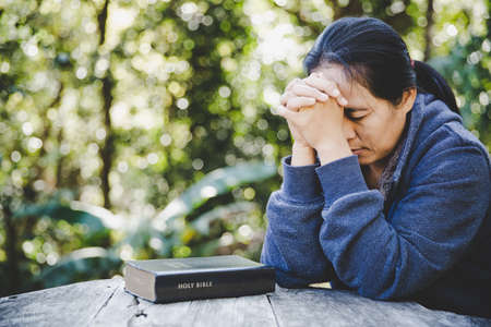 Christian life crisis prayer to god. Woman Pray for god blessing to wishing have a better life....