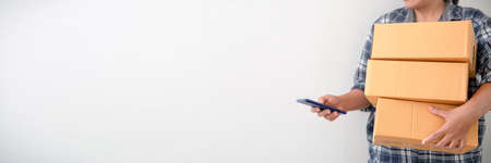 Asian female holding parcel on white background with space for textの写真素材