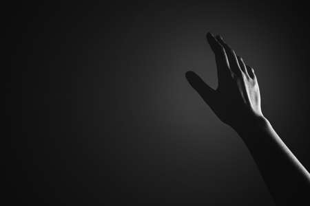 Religion, belief, worship concept copy space: Black and white prayer hands with palms up to pray Godの写真素材
