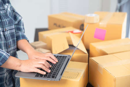 Small entrepreneurs start their SME business at home by arranging their products in parcel boxes....