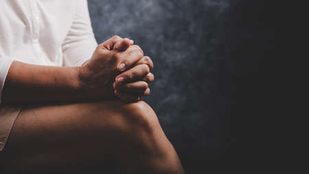 Christian life crisis prayer to god. Woman Pray for god blessing to wishing have a better life. woman hands praying to god with the bible. begging for forgiveness and believe in goodness.の写真素材