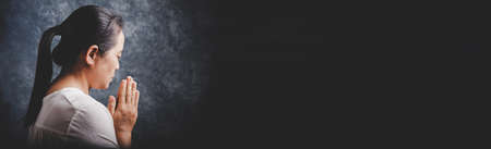 Worship and prayer banner. Woman praying and worship to GOD in Church. Woman pray to GOD. Concept...