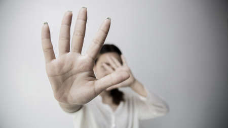 Stop hurting woman! young female person raised her hand for stop violence, sexual abuse, human...