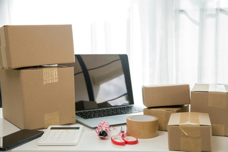 Equipments for SME online business, delivery business laptop, barcode, boxes, checking product on...