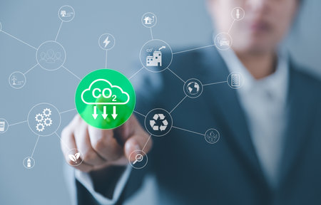 Sustainable development and innovation green business concept. Businesswoman working virtual globe modern computer to reduce CO2 emissions carbon footprint climate change to limit global warming.の写真素材