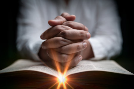 Faith with holy bible concept. Hands of a female prayer worship God with holy bible on black...
