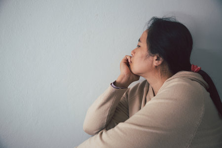 Schizophrenia with lonely and sad in mental health depression concept. Depressed woman sitting...