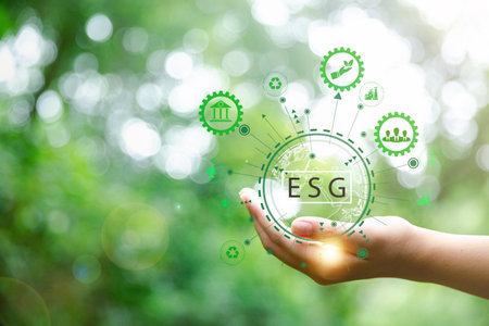 ESG icon concept in hand for environmental, social and governance in sustainable and ethical...