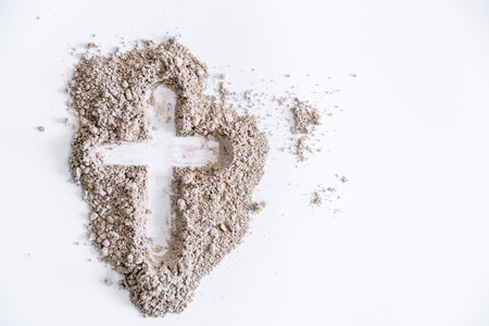 Christian cross or crucifix drawing in ash, dust or sand as symbol of religion, sacrifice, redemption, Jesus Christ, ash wednesday, lent, Good Friday, Easter with Church is devoted to fastingの写真素材