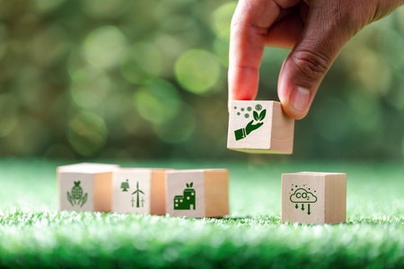 Companies are targeting net zero greenhouse gas emissions. Carbon credit concept.Tradable certificate to drive industry in direction of low emissions in efficiency cost.Wooden cubes with decrease CO2の写真素材