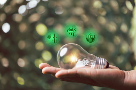 Saving sustainability energy concept, alternative energy, renewable energy power, electricity light lamp from solar on green natural background, World Caring Day, world environment day.の写真素材