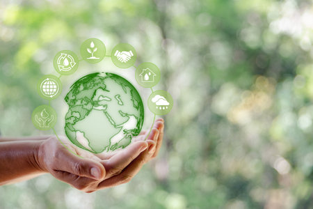 Environment World Earth Day. Technology earth global with icon in human hand on green nature...