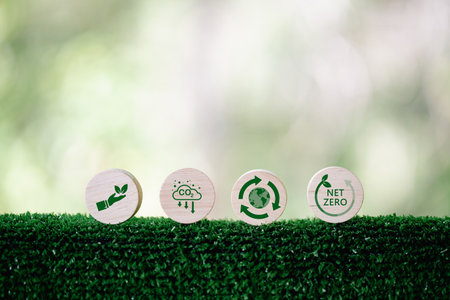 Companies are targeting net zero greenhouse gas emissions. Carbon credit concept.Tradable certificate to drive industry in direction of low emissions in efficiency cost. Wooden cubes with decrease CO2の写真素材