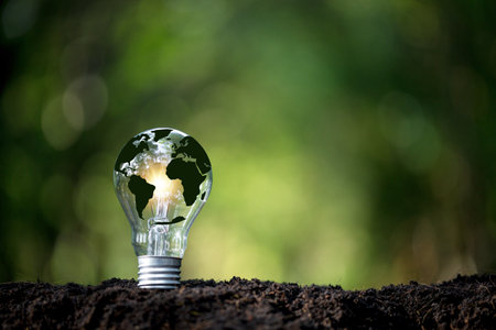 Green world map on light bulb that represents green energy Renewable energy that is important to the world. Renewable Energy. Environmental protection, renewable, sustainable energy sources.の写真素材