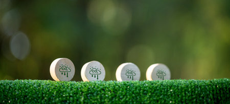 Net Zero and Carbon Neutral Concepts Net Zero Emissions Goals A climate-neutral long-term strategy Ready to put wooden blocks by green net center icon and green icon on bokeh background.の写真素材