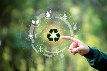 Hand of human touching the recycling symbol with environment icon, Save world, sustainable environment concept. Technology with environment Icons over the Network connection on green background.の写真素材