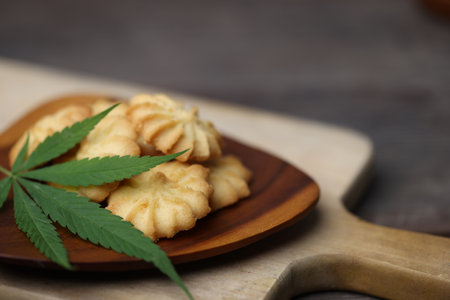 Cannabis or Marijuana cookies is Delicious homemade cookies with CBD. And leaf garnish. Medicinal Edibles. Treatment of medical marijuana. The Cannabis is green herbal medicine is healthy delicious.の写真素材