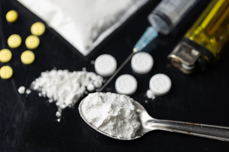 Drug or narcotic is all type of medicine. Addiction to cocaine heroin are harmful to death. drugs are illegal or forbidden. Heroin is a a powder people use syringe and inject into their blood.の写真素材
