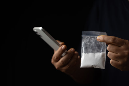 Drug or narcotic is all type of medicine. Addiction to cocaine heroin are harmful to death. drugs are illegal or forbidden. Heroin is a a powder people use syringe and inject into their blood.の写真素材
