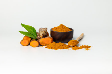 The turmeric powder is a natural herb and is an ingredient for food cooking. The colour of the turmeric powder is yellow when it dry and green when it raw. Asian curry like Indian has yellow powder.の写真素材