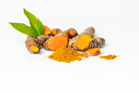 The turmeric powder is a natural herb and is an ingredient for food cooking. The colour of the turmeric powder is yellow when it dry and green when it raw. Asian curry like Indian has yellow powder.の写真素材