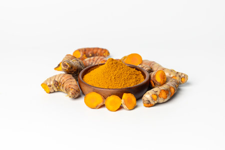The turmeric powder is a natural herb and is an ingredient for food cooking. The colour of the turmeric powder is yellow when it dry and green when it raw. Asian curry like Indian has yellow powder.の写真素材