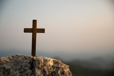 Crucifixion Of Jesus Christ - Cross At Sunset. Silhouette cross on Calvary mountain sunset background. Easter conceptの写真素材